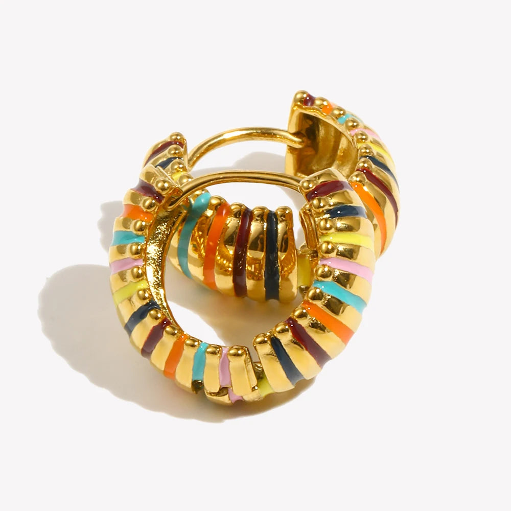 Gold hoop earrings with colorful stripes on a white background