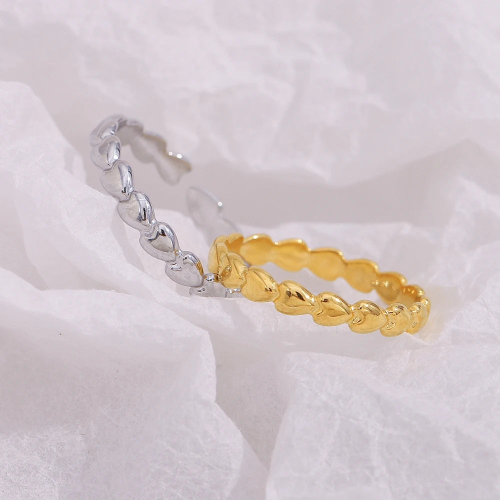 Gold and silver rings on a white fabric background