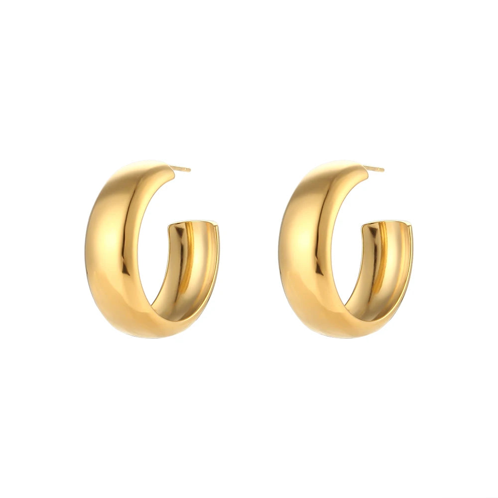 Gold hoop earrings on a white background