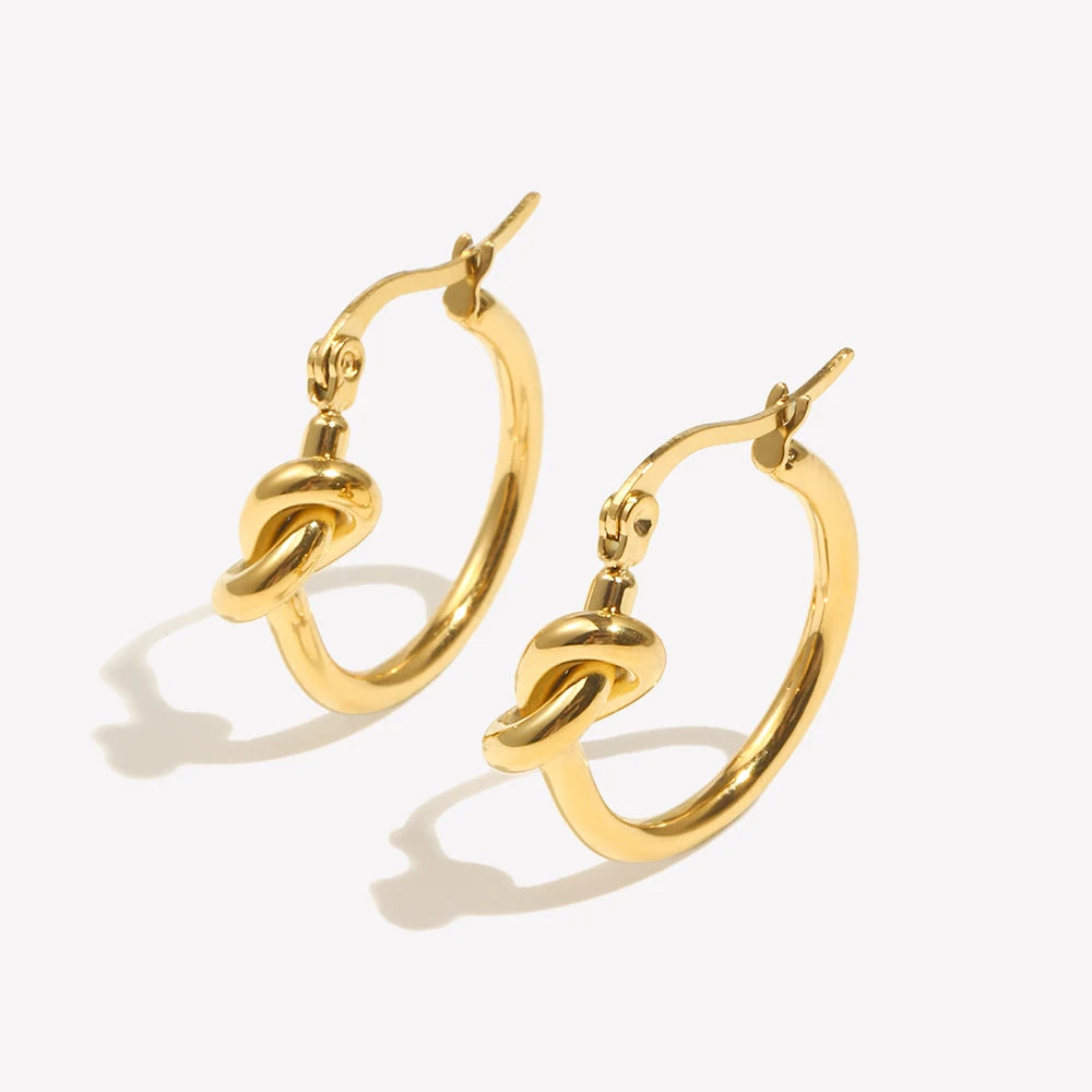 Gold hoop earrings on a white background