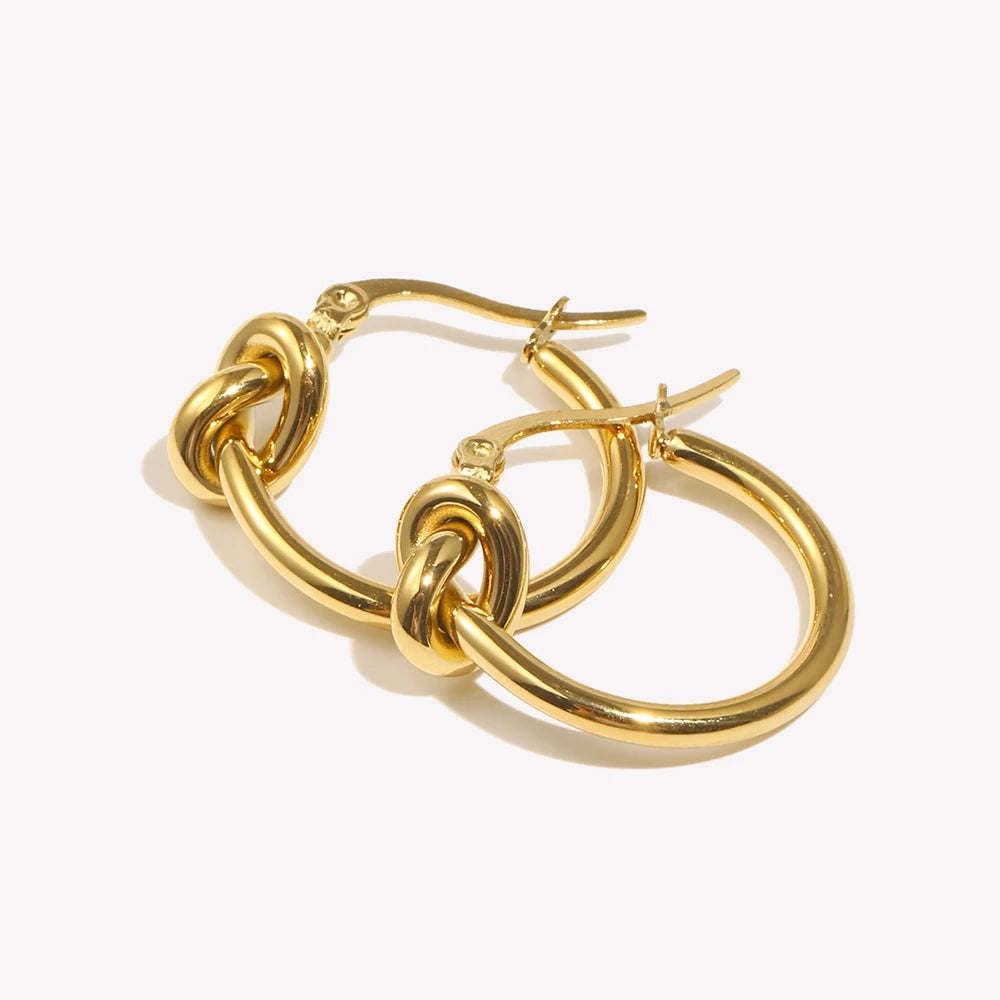 Gold hoop earrings on a white background