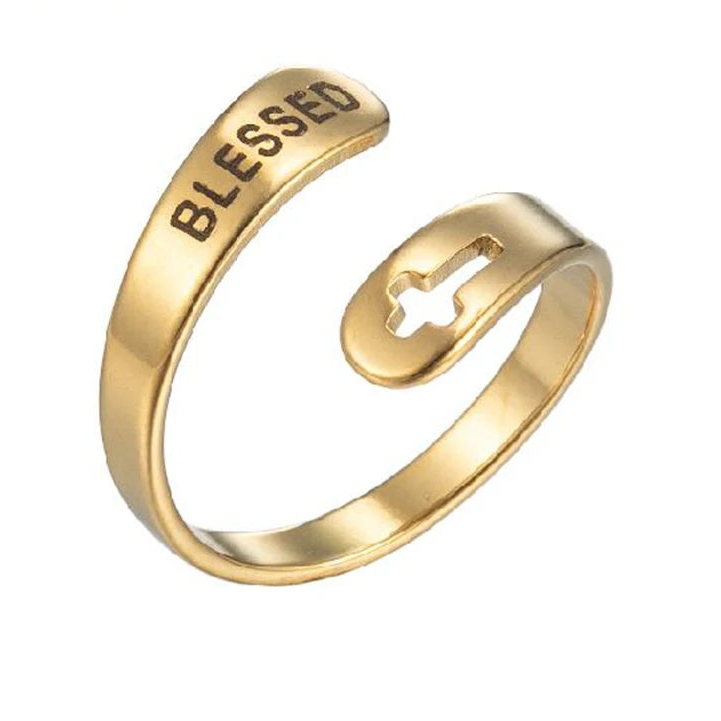 Gold ring with 'BLESSED' engraving on a white background