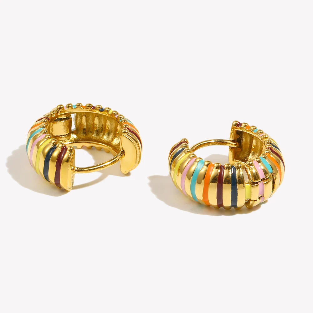 Gold hoop earrings with colorful stripes on a white background