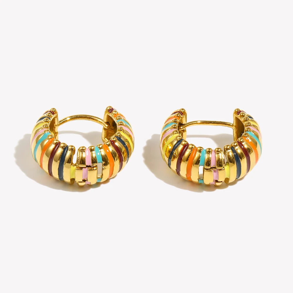 Pair of gold hoop earrings with colorful stripes on a white background