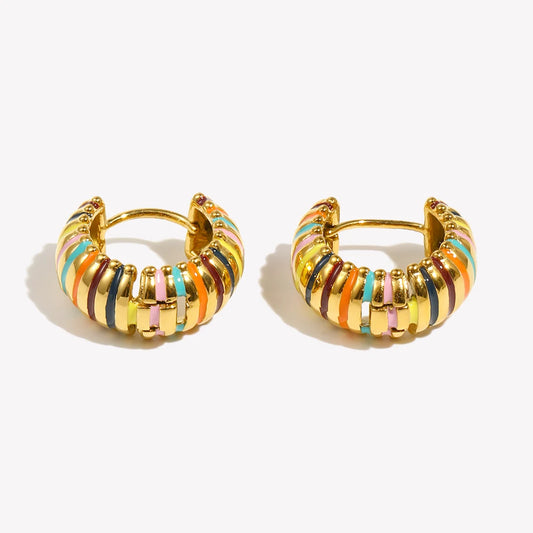 Pair of gold hoop earrings with colorful stripes on a white background