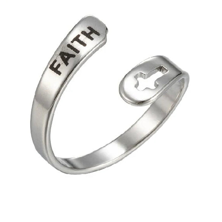 Silver ring with 'FAITH' engraving on a white background