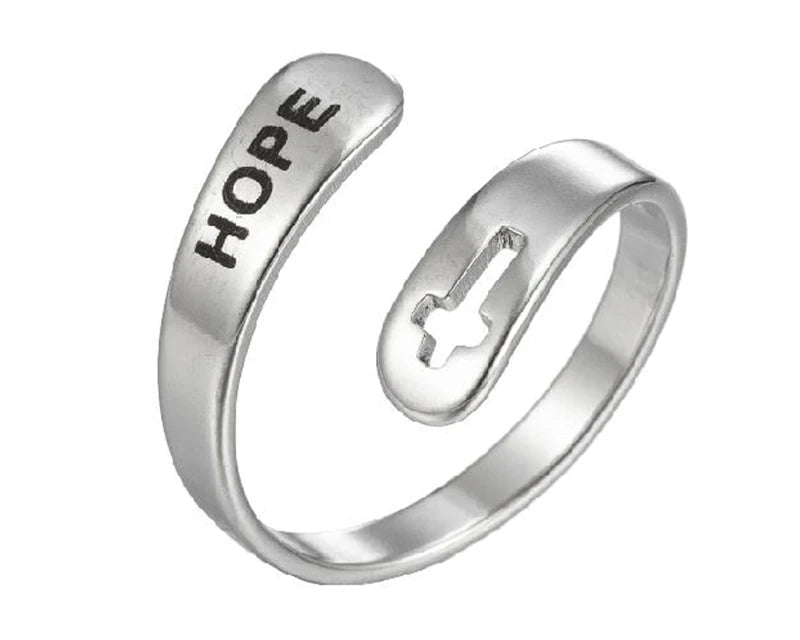 Silver ring with 'HOPE' engraving and cross design on a white background