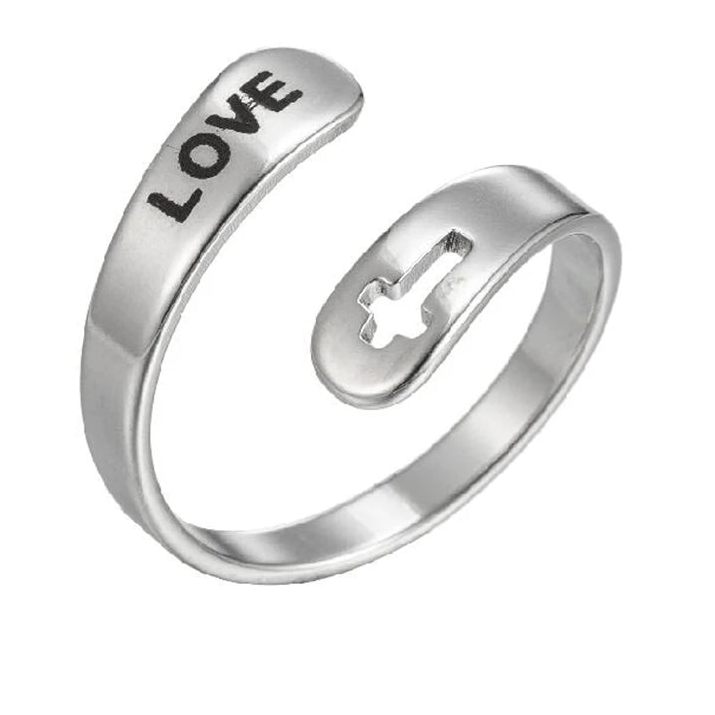 Silver ring with 'LOVE' engraving and cross cut-out design on a white background