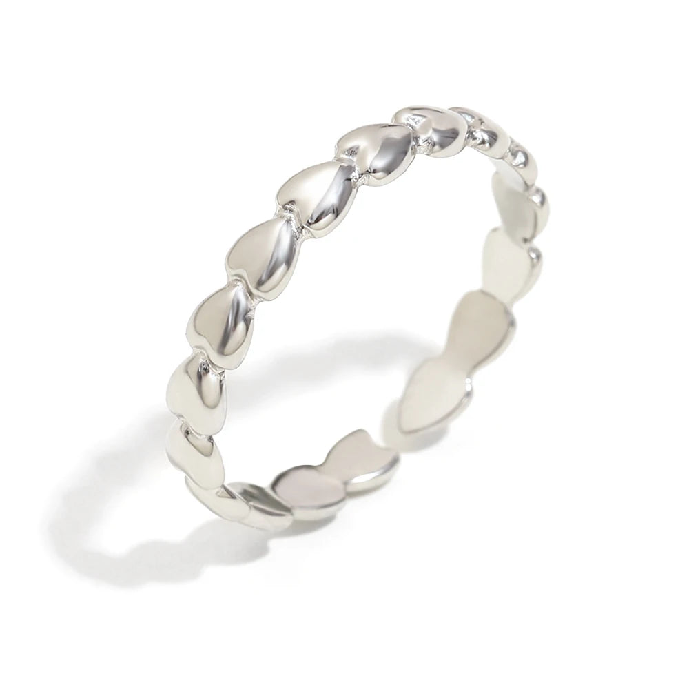 Silver ring with a unique design on a white background